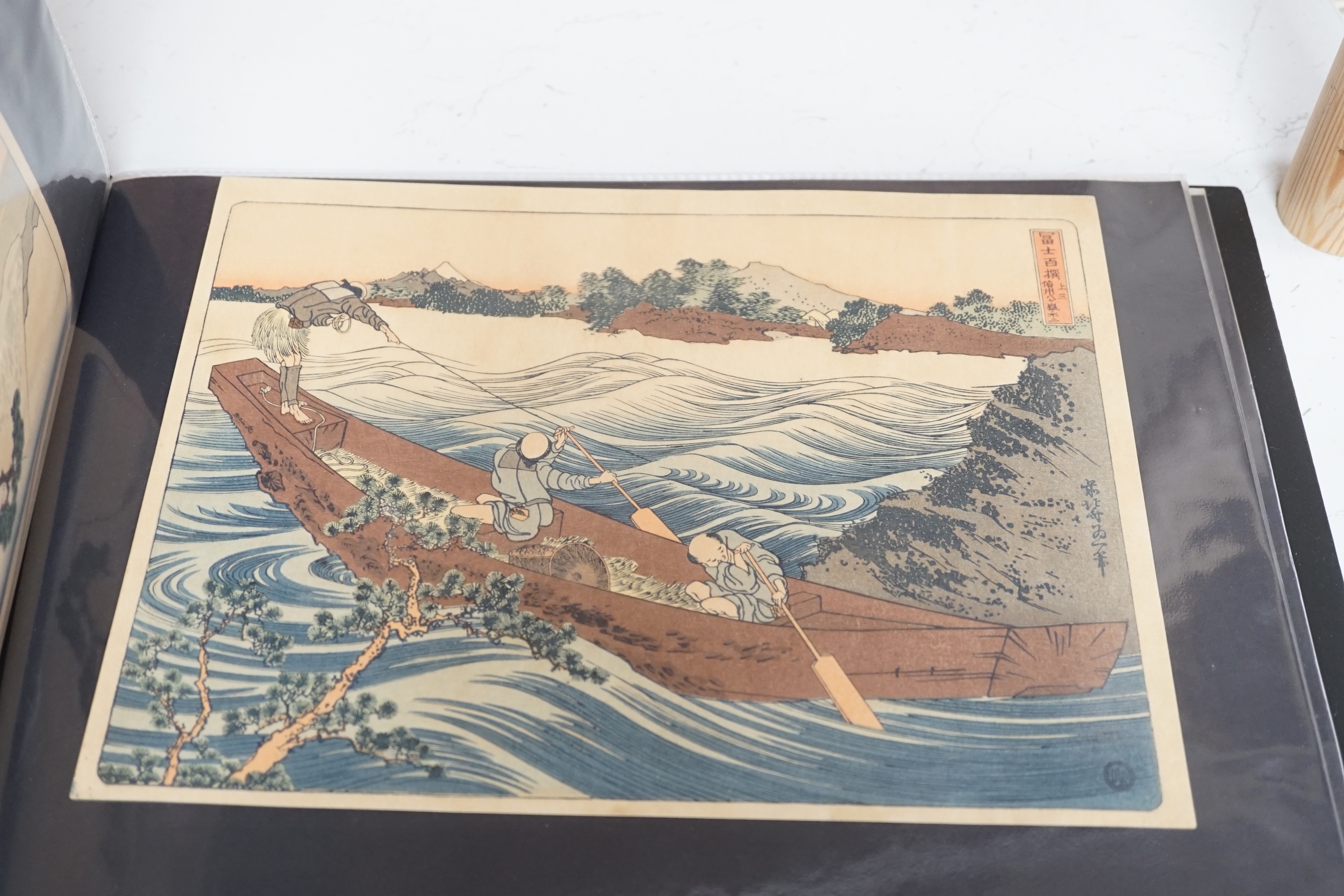 After Hiroshige and Hokusai, a collection of republished woodblock prints, 20th century, all unmounted in an album